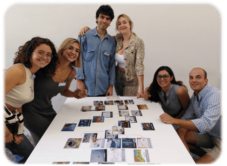 Group of 6 posing in front of the Climate Fresk they just made